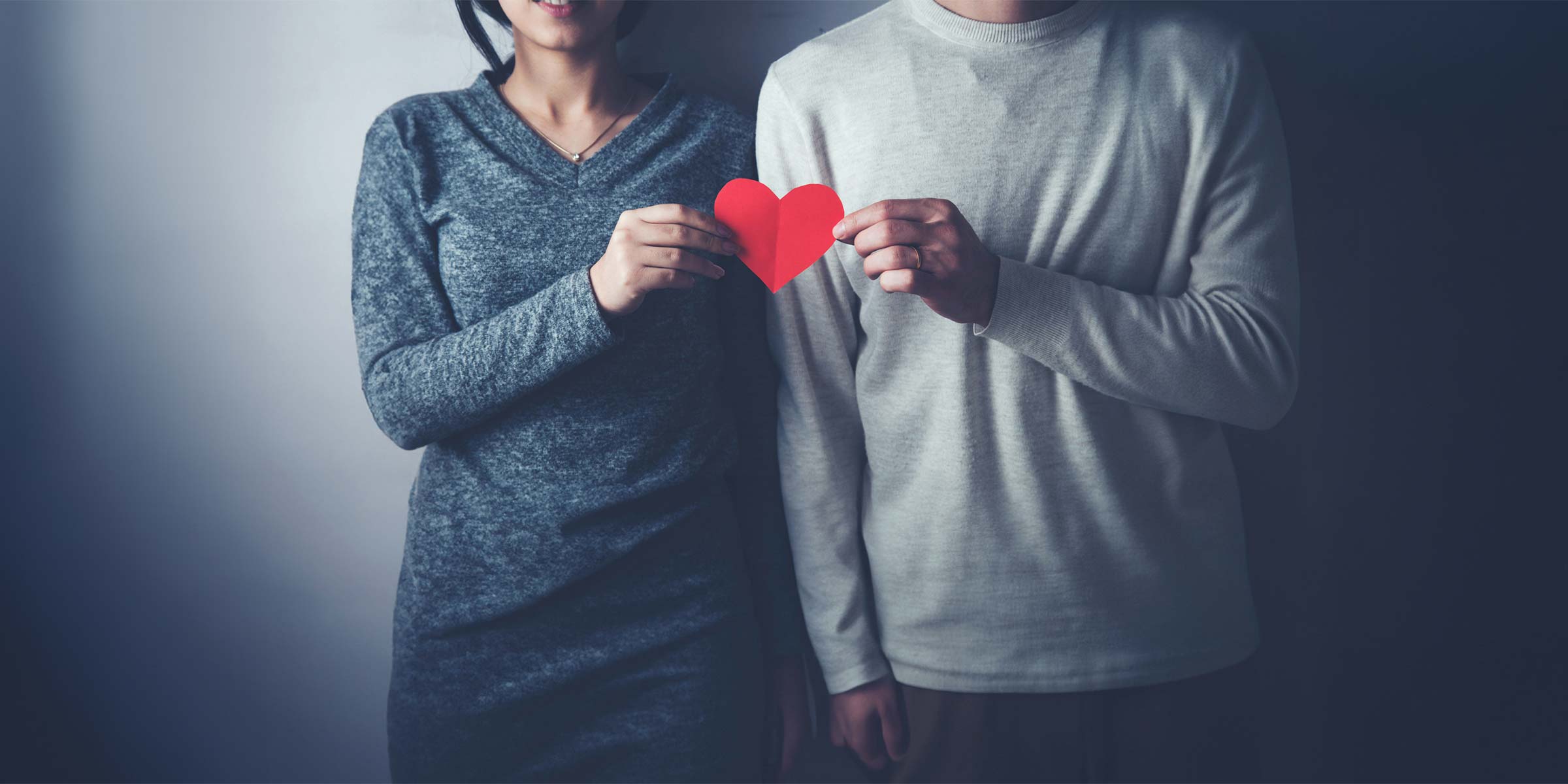 Couple Holding a paper heart