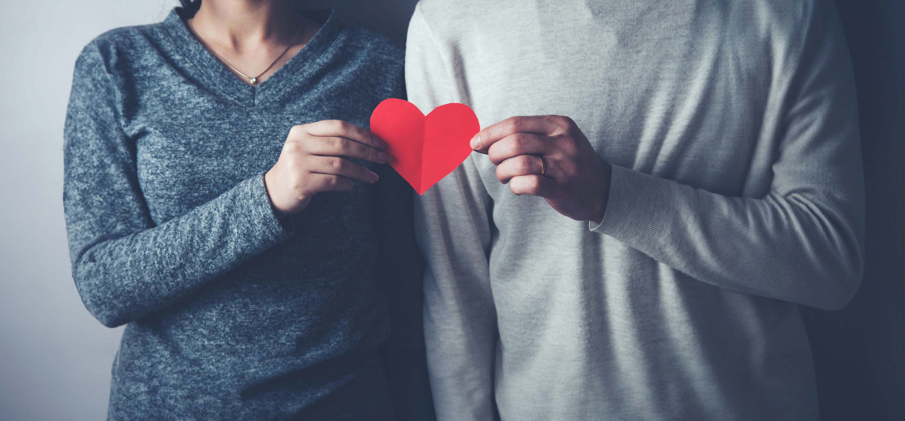 Couple Holding a paper heart
